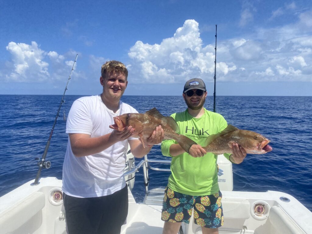 Two men holding big fish | Thermocline Fishing Charters | Gulf of Mexico Offshore Deep Sea Fishing Trips | St Pete Florida