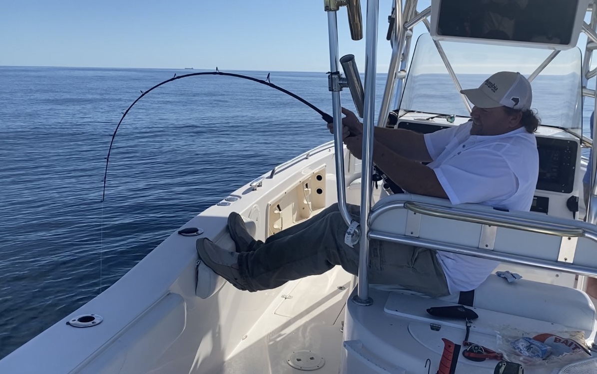 Man fishing on a boat | Thermocline Fishing Charters | Gulf of Mexico Offshore Deep Sea Fishing Trips | St Pete Florida