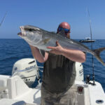 Man holding a big fish | Thermocline Fishing Charters | Gulf of Mexico Offshore Deep Sea Fishing Trips | St Pete Florida